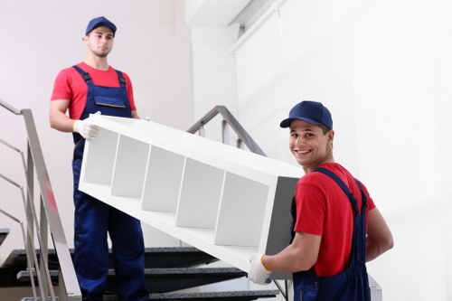 Staff separating cardboard, plastics, and packaging for recycling