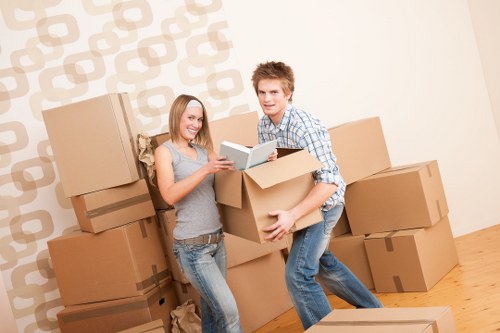 Well-arranged boxes and furniture in an accessible Merton storage facility