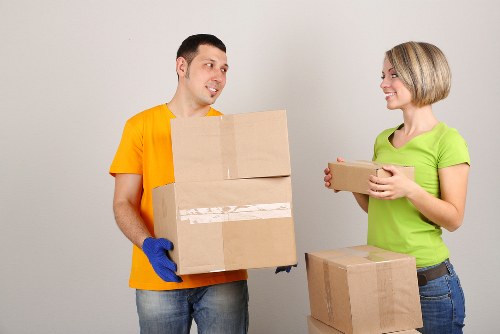 Loading household items into a mobile self storage unit in Merton